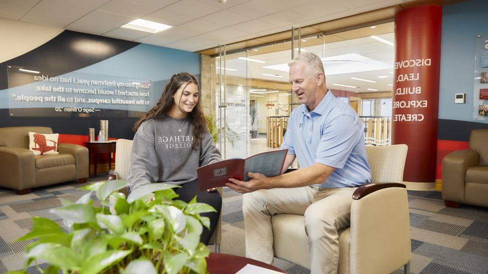 Admissions rep Greg Huss meets with a prospective student.